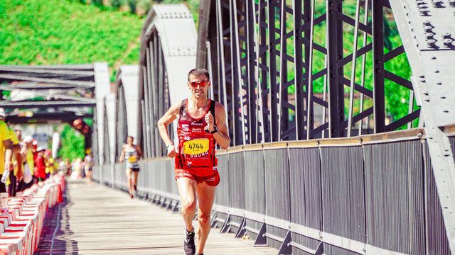 Man running marathon at bridge
